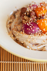 Udon noodles with chicken, vegetables and sesame