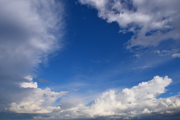 White clouds framing a blue sky