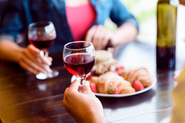 Cheerful loving couple dating in restaurant