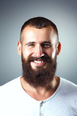 Obraz premium Portrait of handsome man standing, isolated on grey background