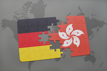 puzzle with the national flag of germany and hong kong on a world map background.