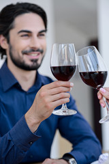 Pretty loving couple drinking wine