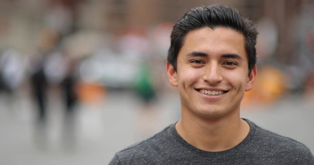 Young latino man in city face portrait smile - 115467073