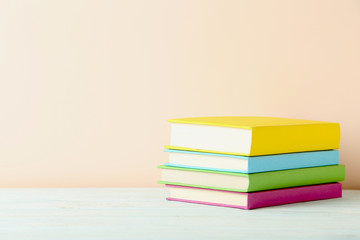 Books on a green wooden table