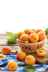 Ripe apricots fruit on grey wooden table