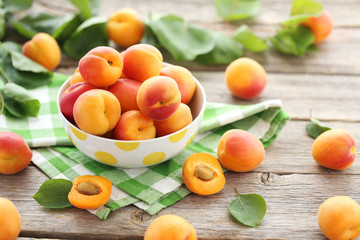 Ripe apricots fruit on grey wooden table
