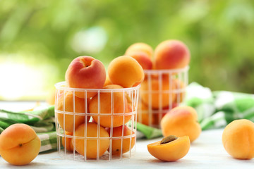 Ripe apricots fruit on white wooden table