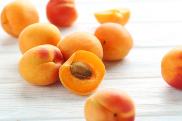 Ripe apricots fruit on white wooden table