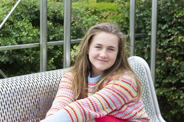 School girl in sweater outdoors