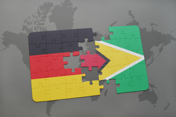 puzzle with the national flag of germany and guyana on a world map background.