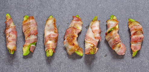 Roasted avocado pieces wrapped in bacon