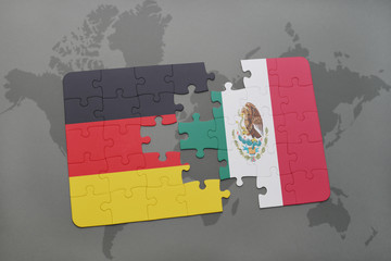 puzzle with the national flag of germany and mexico on a world map background.