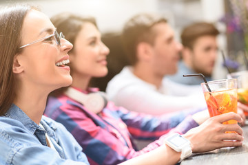Group of young friends meeting in cafe