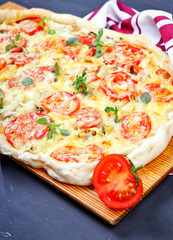 Delicious italian pizza served on wooden table