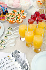 Set of cold snacks, canape, beverages and dessert, closeup
