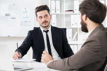 Hardworking businessmen discussing something