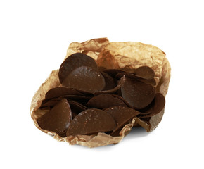 Chocolate chips in parchment on white background