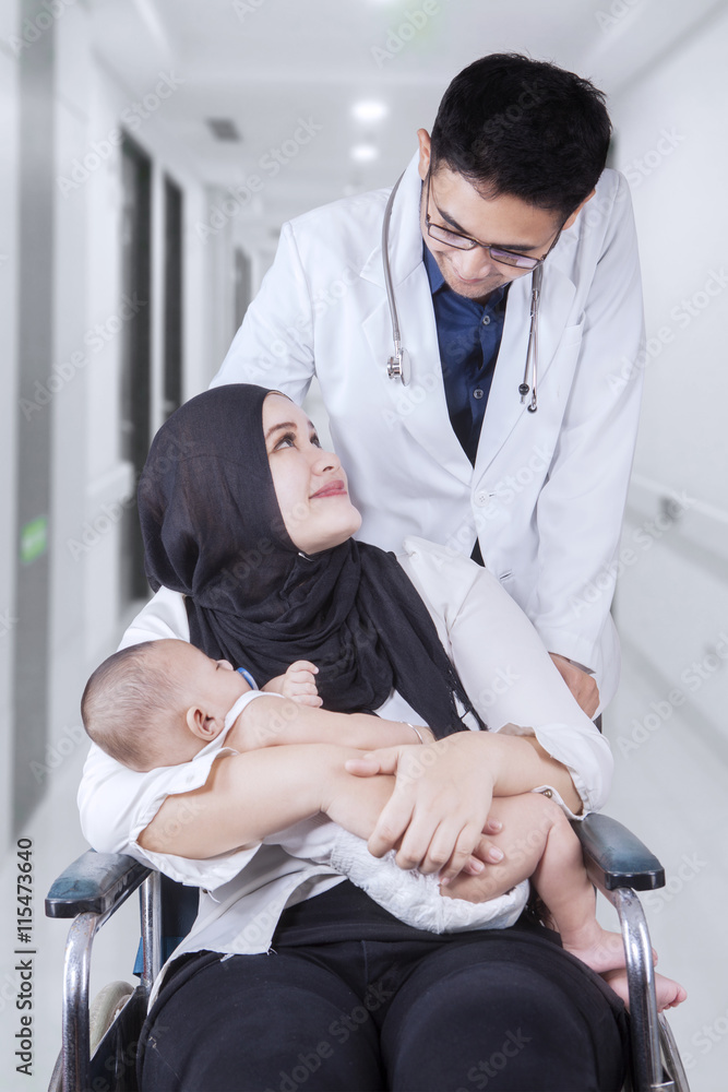 Canvas Prints Doctor discussing with patient in hospital alley