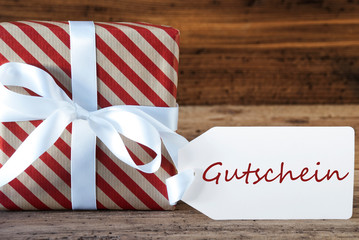 Fototapeta na wymiar Present With Label, Gutschein Means Voucher