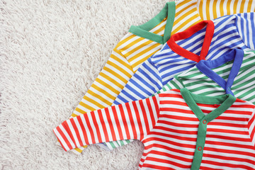 Baby clothes on light background