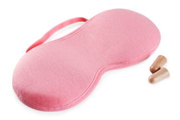 Sleeping mask and earplugs, isolated on white