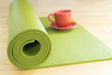 yoga mat and a cup of coffee