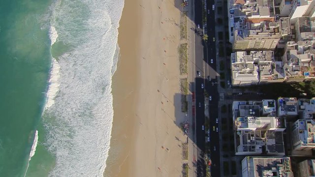 Flying directly above Ipanema Beach mosaic with ocean, Rio De Janeiro, Brazil