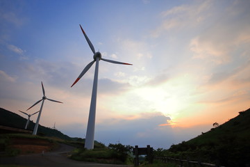 Windmill in sunset. Aso, Kumamoto, Japan