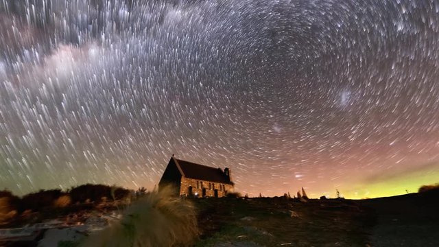 Aurora Borealis or The Southern Light and Star Trails above Church Of Good Shepherd, Tekapo, New Zealand. Camera Pan Right