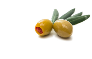 Green olives with leaves isolated