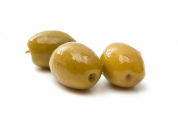 Green olives with leaves isolated