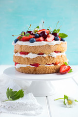 summer sponge cake with cream and fresh berries