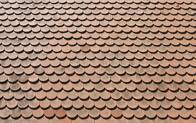 Brown tile roof in sunny day as background