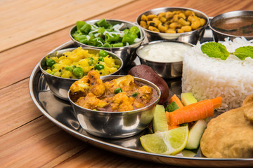 indian food platter, indian thali, indian veg thali,paratha, rice, aalu bhaji,puri or poori,...