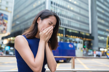 Woman suffer from nose allergy due to air pollution