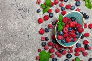 Fresh summer berries in vintage bowl 