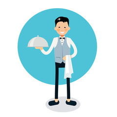 Young cheerful waiter stands with serving tray and napkin on han