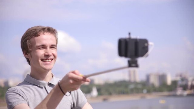 Man Takes Selfie in city, urban landscape. 1080p
