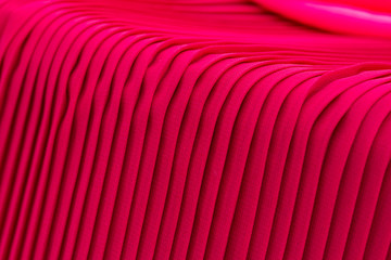 Red pleated fabric texture background 