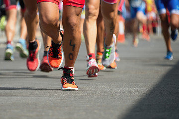 Fototapeta premium Marathon competition during an ironman the numbers on the leg