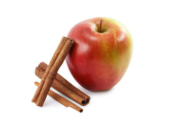 red apple and cinnamon isolated on white background