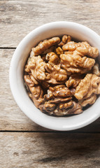 Walnut kernel in a white bowl