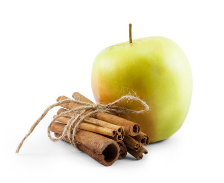 Green Apple And Cinnamon Isolated On White Background