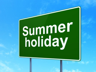 Tourism concept: Summer Holiday on road sign background
