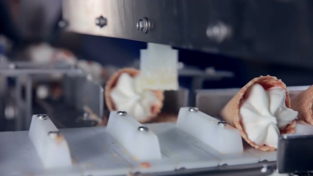 Modern ice cream automatic production line. Automatic equipment at the food factory. 1080p.