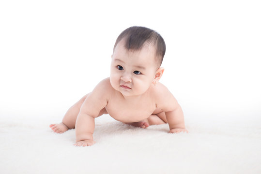 Funny crawling baby girl isolated on white background
