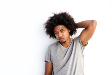Fototapeta na wymiar Male fashion model with afro posing with hand in hair