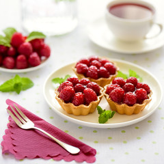 Fruit raspberry tarts on a table