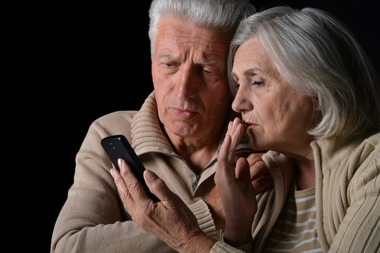 Sad  Senior Couple With Phone