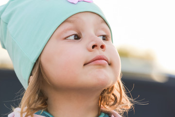Closeup face portrait of funny cute baby girl